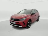 a red car in a white room with a white floor