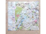 a map of paris on the floor of a room