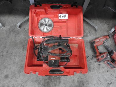 a red tool box with tools in it on the floor