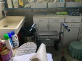 an image of a messy kitchen with a lot of clutter on the floor