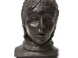 statue of a man with a head of hair on a white background