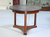 a small table with a marble top in a room