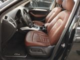the interior of a car with brown leather seats and steering controls