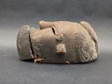 an image of a stone head with a hole in the middle