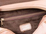the inside of a pink purse with a zipper on it