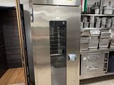 a large stainless steel oven in the middle of a kitchen