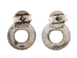 pair of antique silver plated earrings with screws on a white background