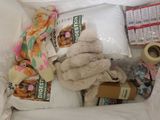a pile of items that is sitting on a bed