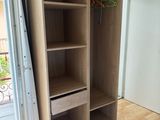 a closet with a shelf and a drawer in it