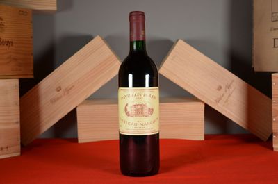 a bottle of red wine sitting on a table