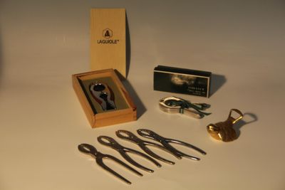 a box with scissors and other items on a table