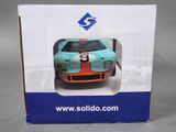 a box with a model of a racing car in it