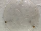 a glass plate with a design on it on a table