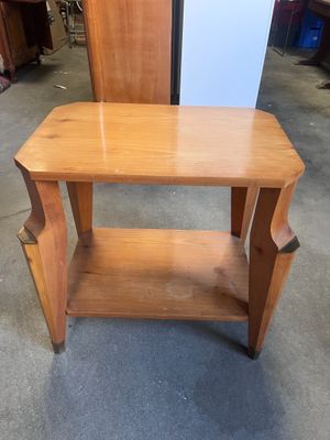a small wooden table with a shelf underneath it