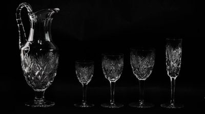 black and white photograph of a group of wine glasses and a pitcher