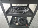 an image of a metal work cart with wires and wires