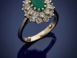 an emerald and diamond cluster ring