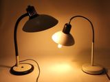 two lamps that are sitting on a table next to each other