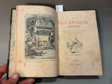 someone is holding an old book with a drawing on it