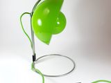 an image of a green lamp that is connected to a charger