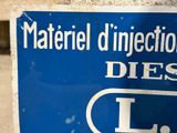 a blue sign that says material injections and diesels on it