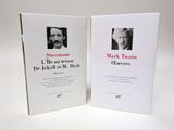 deux livres posés sur une table blanche, avec la photo d'un homme et d'une femme