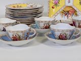 a lot of cups and saucers that are sitting on a table