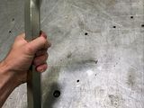 a hand that is holding a wrenet on a table