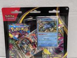 a close up of a package of pokemon cards on a white surface