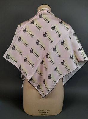 pink and black cat print scarf on a mannequin mannequin head