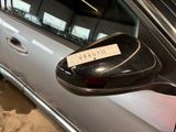 a side view mirror of a car with a sticker on it