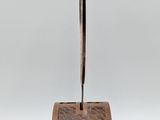 an image of a wooden pen holder with a pen on it