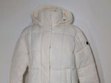 the jacket is white and has a hood that is attached to it