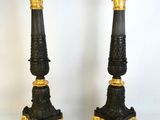 pair of antique black and gold candlesticks on marble bases