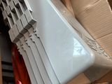 a woman ' s hand holding a laptop computer in a box