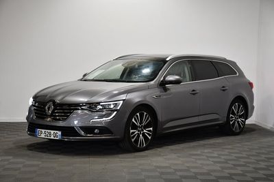 a grey volkswagen suv parked in a room with a checkered floor