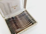 a lot of spoons in a box on a table