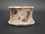 a close up of a small cup on a table