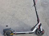 a scooter that is sitting in the street
