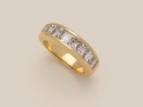 an 18k yellow gold ring with princess cut diamonds