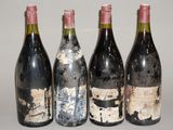 quatre bouteilles de vin sont alignées