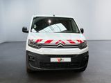 the white van is parked in a white room with a red stripe