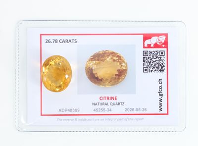 deux saphirs jaunes sur une carte blanche avec un code QR
