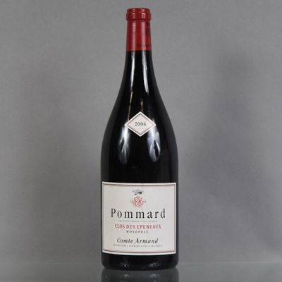 the bottle of wine is sitting on the table on the table