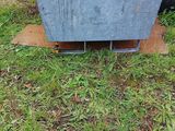 a large metal box sitting on the grass in the yard