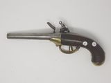 an old gun that is on display on a table