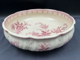 an image of a red and white bowl on a table