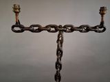 an image of a candle holder made out of chains