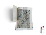 an open book with a map on it on a white surface