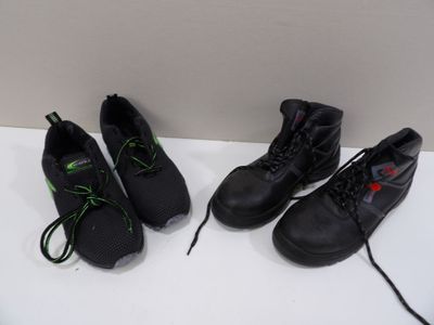three pairs of black shoes with green laces on a white surface